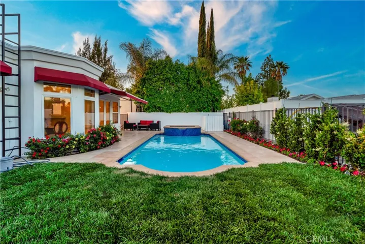 Pool and back of home from right fence