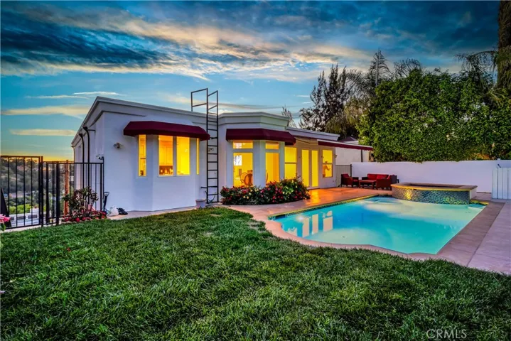 Pool and back of home from right fence