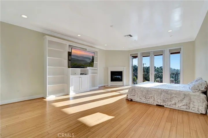Primary bedroom from corner wide
