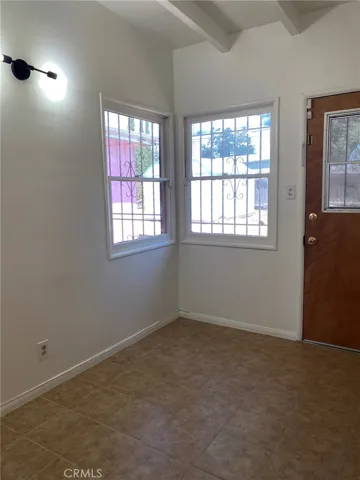 Kitchen showing space for table and door to back yard.