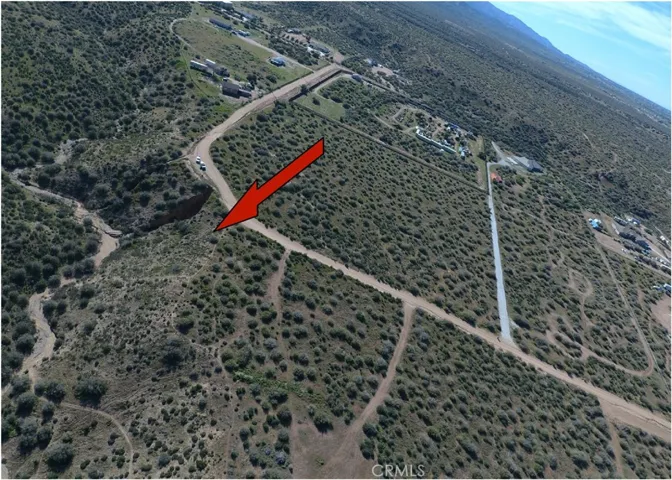 has a slope/wash that runs through the property