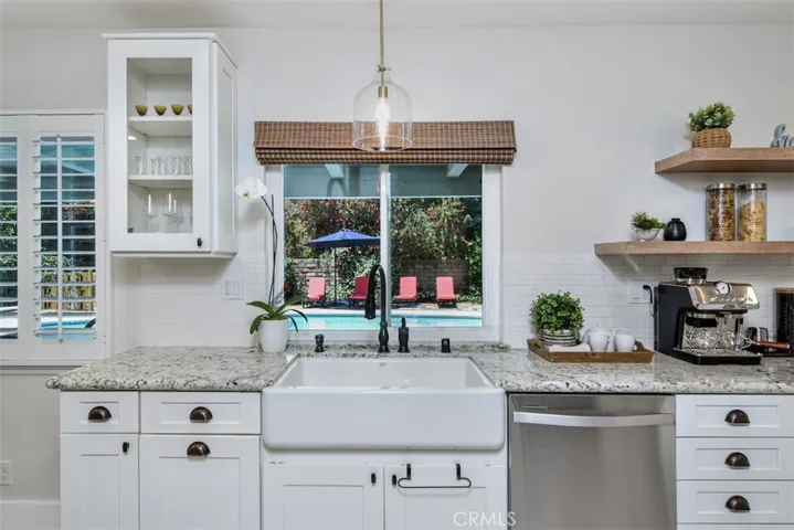 Farmhouse Sink with Window looking out to the Backyard