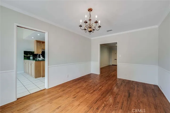 Spacious Dining Room with beautifully maintained hardwood floors.