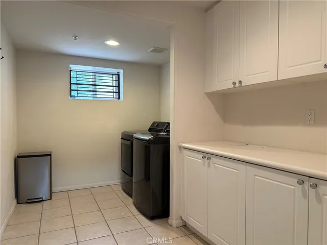 Laundry room on bottom level next to garage