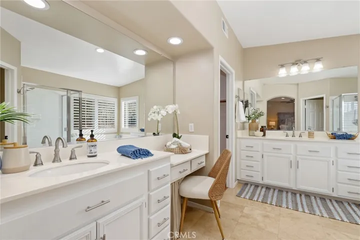 Separate vanities and walk in closet