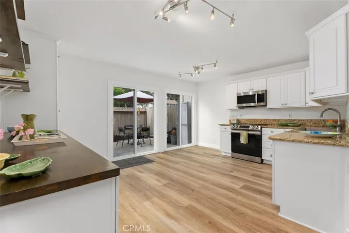 Remodeled kitchen with added storage and shelving.