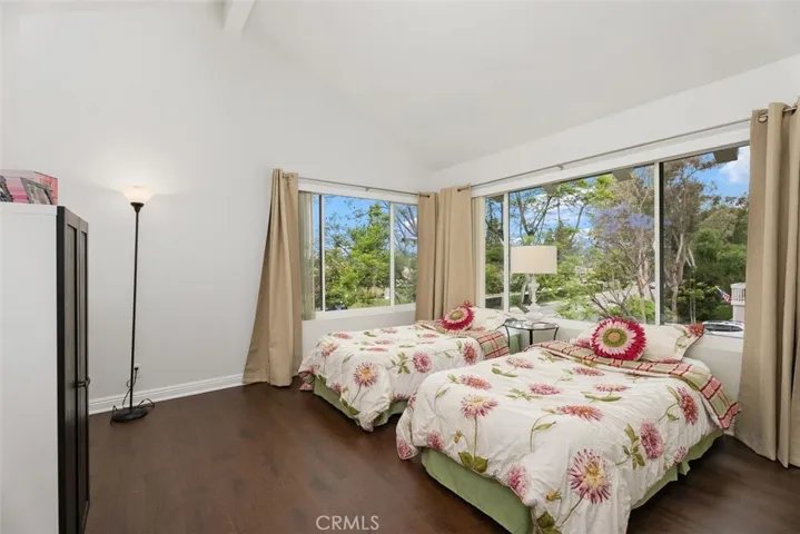 Secondary bedroom is light-filled with pretty views.