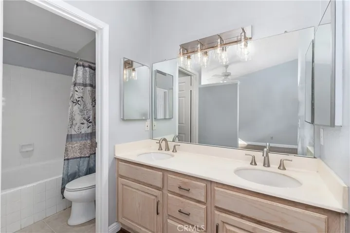 Second Primary Bedroom Bathroom with a large oval tub shower combo