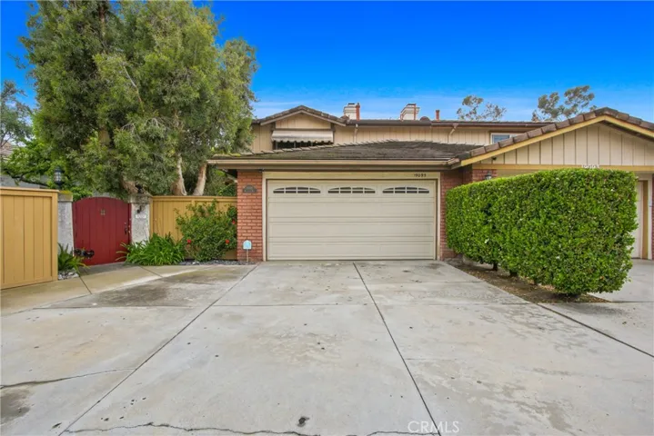 Front view with garage and long driveway for additional parking