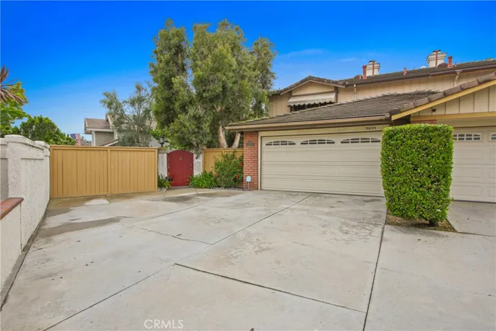 Front view with garage and long driveway for additional parking