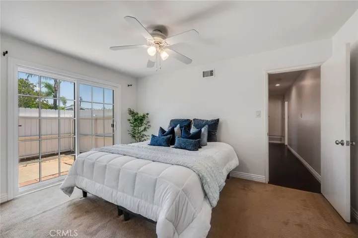 Primary Bedroom that looks into private side yard patio area