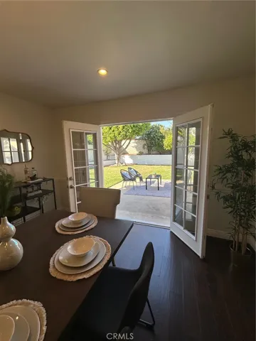 Dining Room that looks out onto the Back Yard and patio
