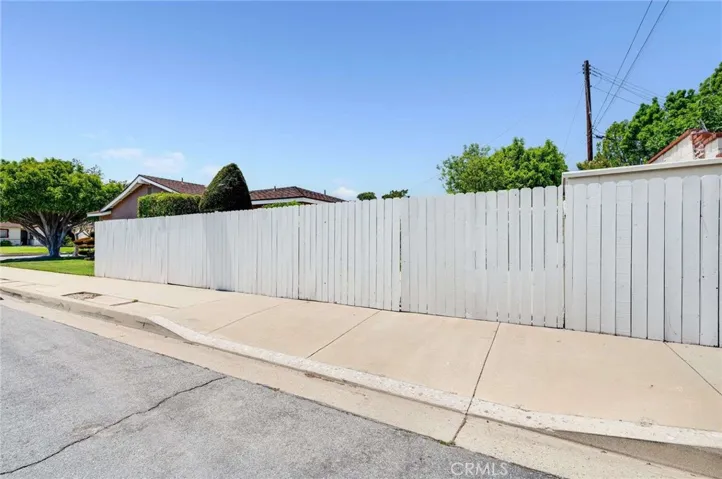 Side of property fencing with access to RV parking area.