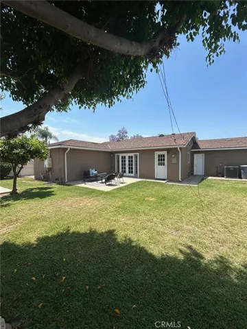 Spacious landscaped back yard with patio