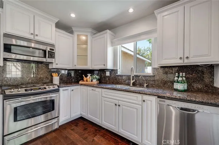 Granite counter tops and stainless steel appliances adorn this beautiful chefs kitchen