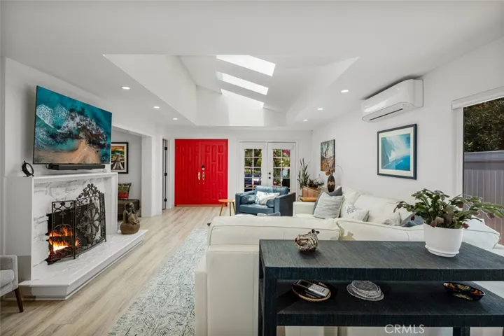 Looking across living room toward front door. Kitchen is behind you.