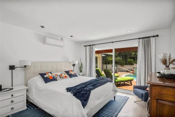 Bedroom 2 opens to pool area. Slider allows the wonderful breezes in.