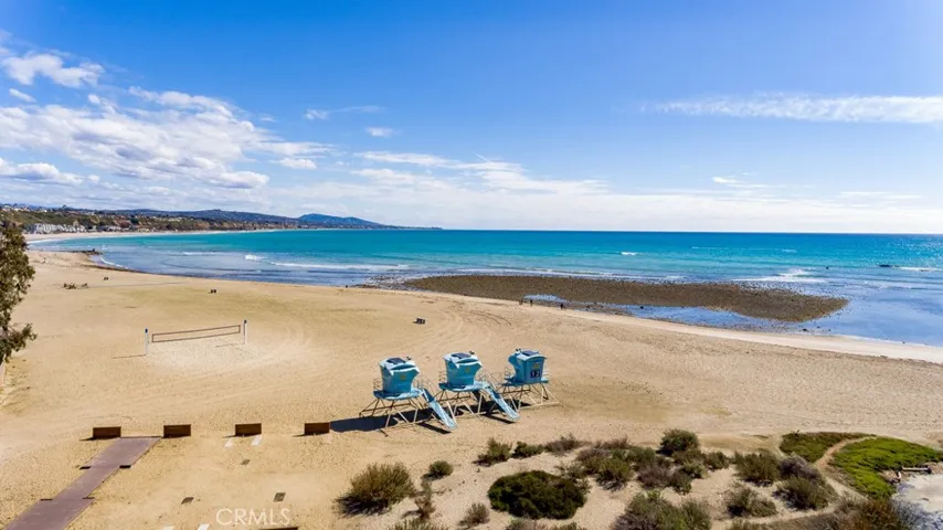 Sand volleyball courts and BBQ areas are along Doheny Beach.