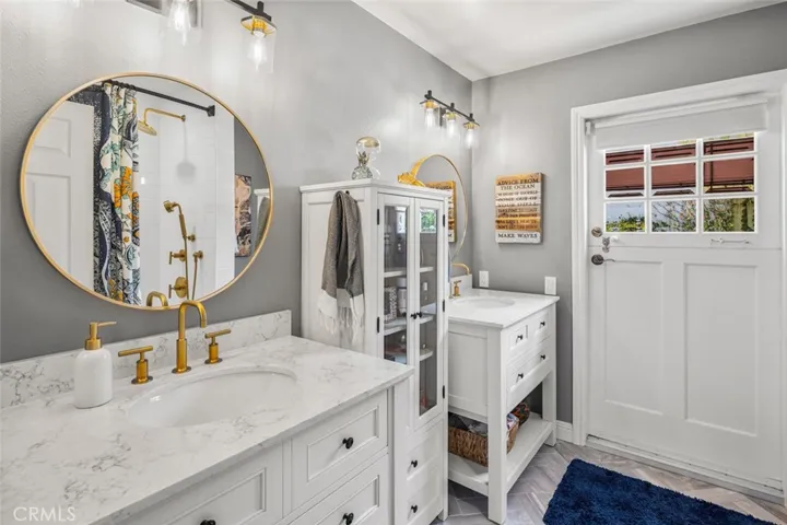 Secondary Bath has dual sinks, large quartz counters