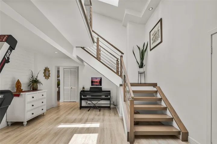 The first opening on right takes you into the space this family uses to work out in. Stairs lead to loft.
