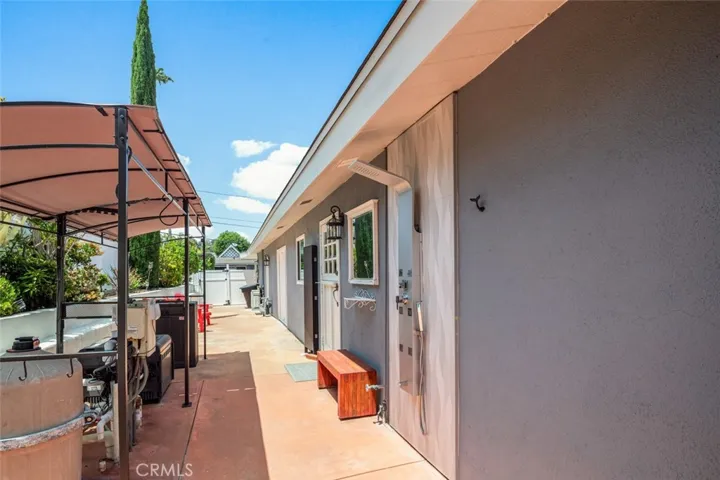 West side of home is large space with access to garage. Outside Shower from pool area.