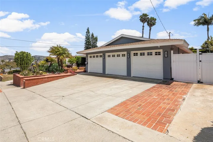 The coveted 3 car garage! Across the front are 4 parking space. Each bay has it's own door.