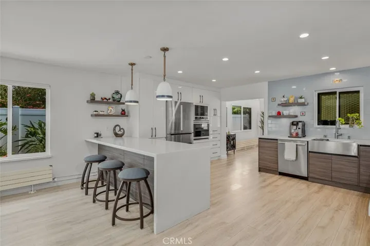Enter the Kitchen! The Mid-Centry Modern look is carried thoughout including the backsplash tiles from a Mid-Century Modern Tile maker Motawi Teleworks which were shipped half way across the country!