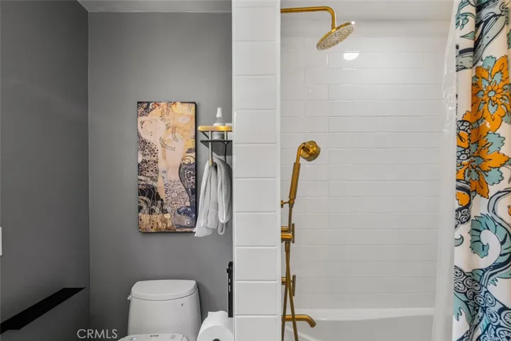 A Large Secondary Bath is a dream and opens to the side yard's outdoor shower is located. New Toto toilets and bath.