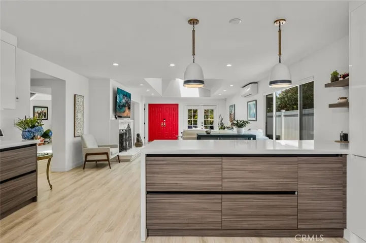 The view from the other side of the Breakfast Bar. All cabinets are self closing. Drop sconces are included with the house.