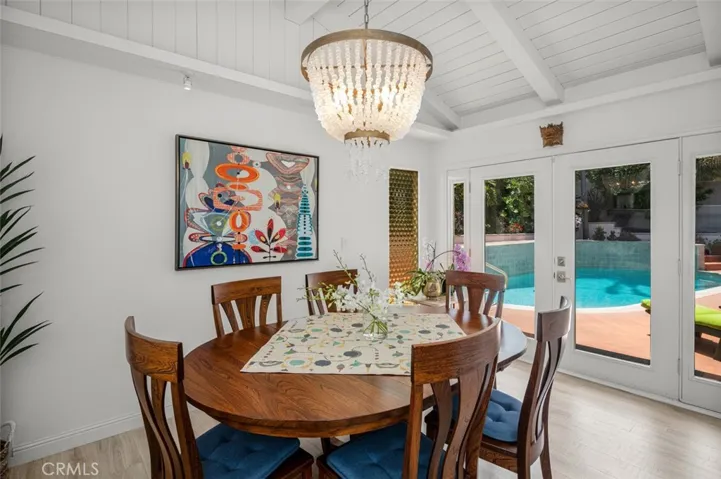 Open the French doors and enjoy the day while you Bruch. Chandelier stays with home.