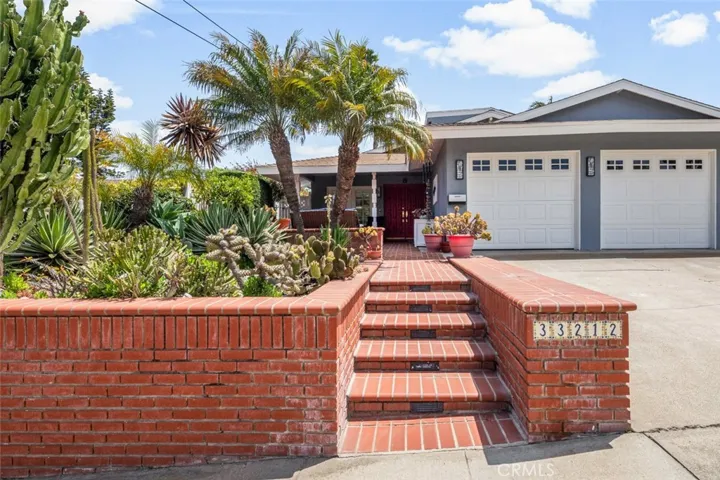 True Mid-Century Modern Single story with loft/office bonus 1.5 miles from the BEACH! Catch the bike trails to beach at the bottom of the hill. Come in and see this 3 Bdrm-2.5 B home that lives like a single story with a loft above!!