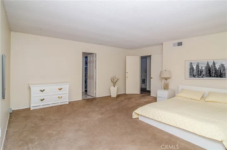 Primary bedroom with ensuite bathroom / virtually staged