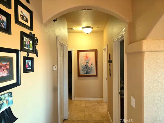 Hallway to bedrooms 2, 3 and four as well as bathroom, garage and laundry room.