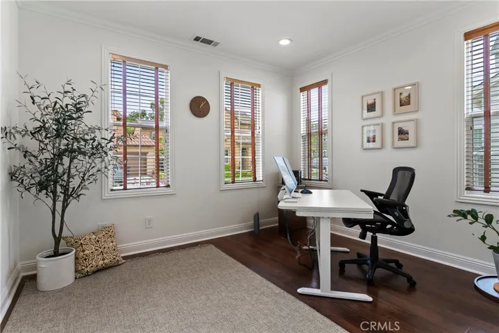 Versatile front room ideal for home office, creative space, or guest area