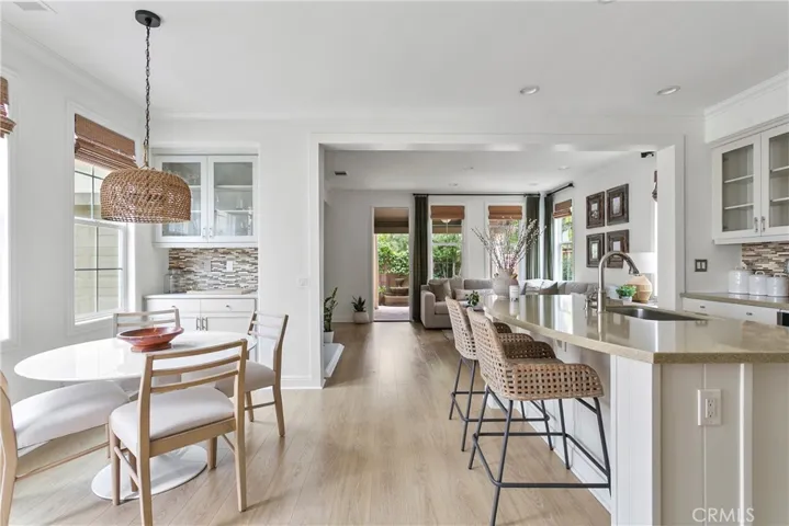 Light-filled living space with serene views to the private patio and custom window treatments
