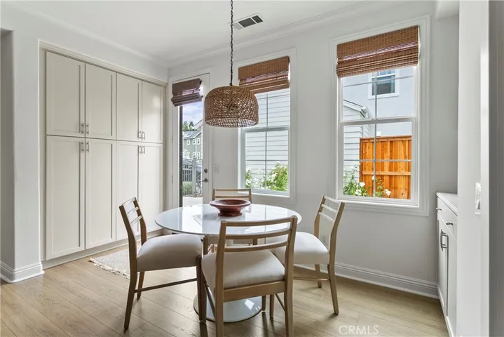 Bright Dining area with built-in cabinetry