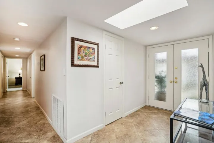 Foyer and hallway to primary