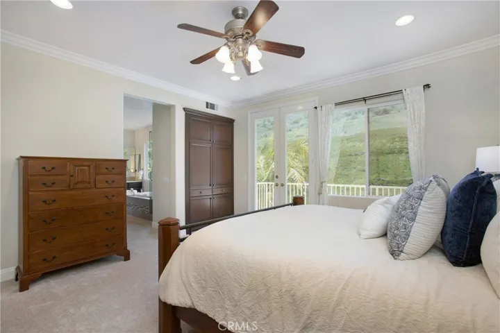 Built in cabinetry in primary suite adds even more storage