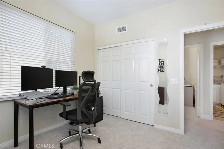 Secondary bedroom being used as an office