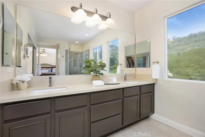 Quartz countertops, brushed hardware and lighting