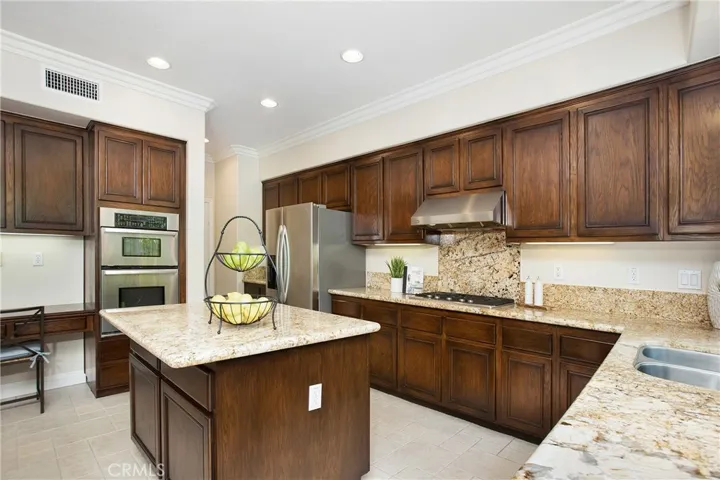 Kitchen features center island and an abundance of newly refinished cabinetry