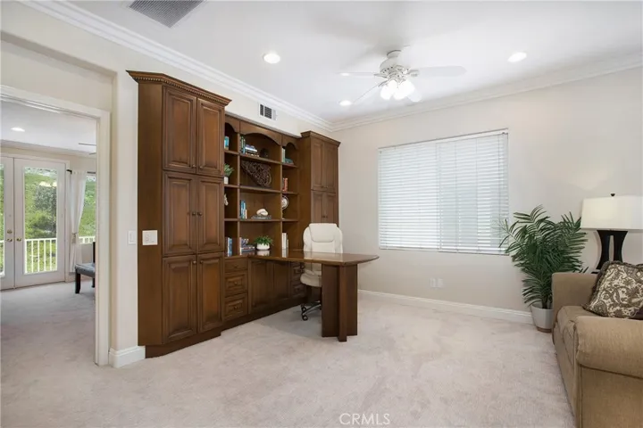 Built ins in bonus room are the perfect place to study or work - can be converted to entertainment center