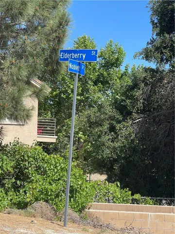Lot is across from this street sign