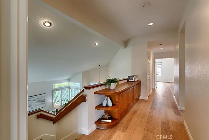 Built-in cabinets in wide hallway, plus a linen closet