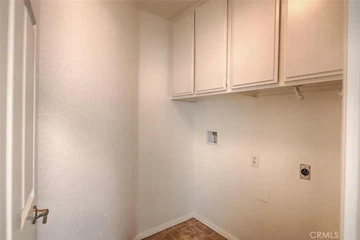 Laundry room across from bathroom