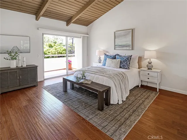 Primary Bedroom with Balcony and View