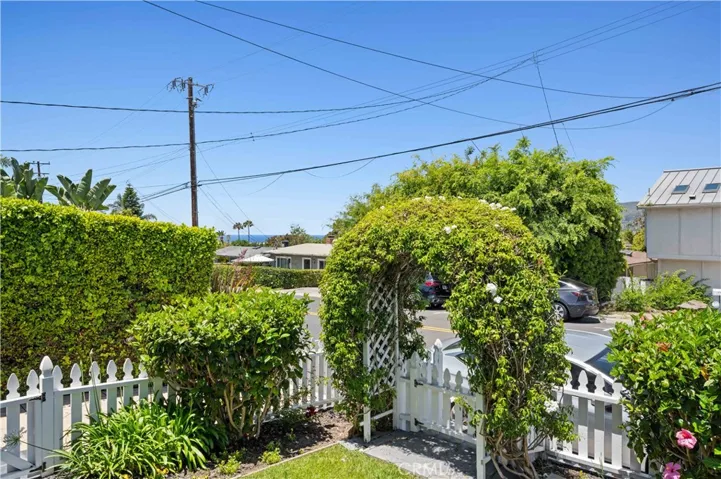 While the generous front yard welcomes you with ocean views right from the front door.