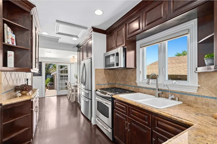 The kitchen opens to an additional seating area.