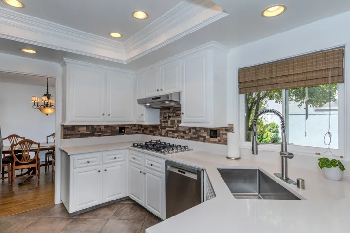 kitchen (standing in den)