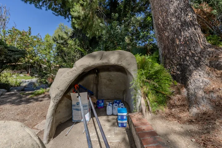 adjacent storage cave near pool pumps (not visible from pool or house)